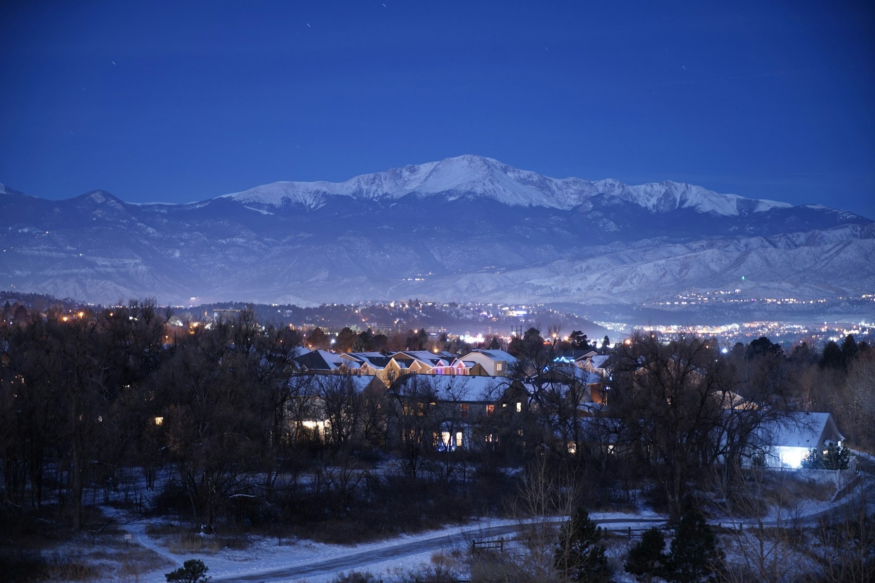 Colorado Springs home with the Rocky Mountains behind it